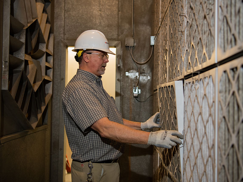 Man changing an air filter