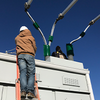 MidAmerican employee installing wildlife shield