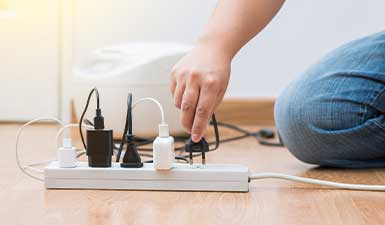 woman unplugging hair dryer