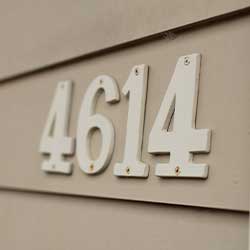 White house number 4614 mounted on siding