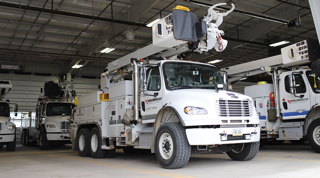 MidAmerican bucket trucks, prepared and waiting to be called into action before a storm