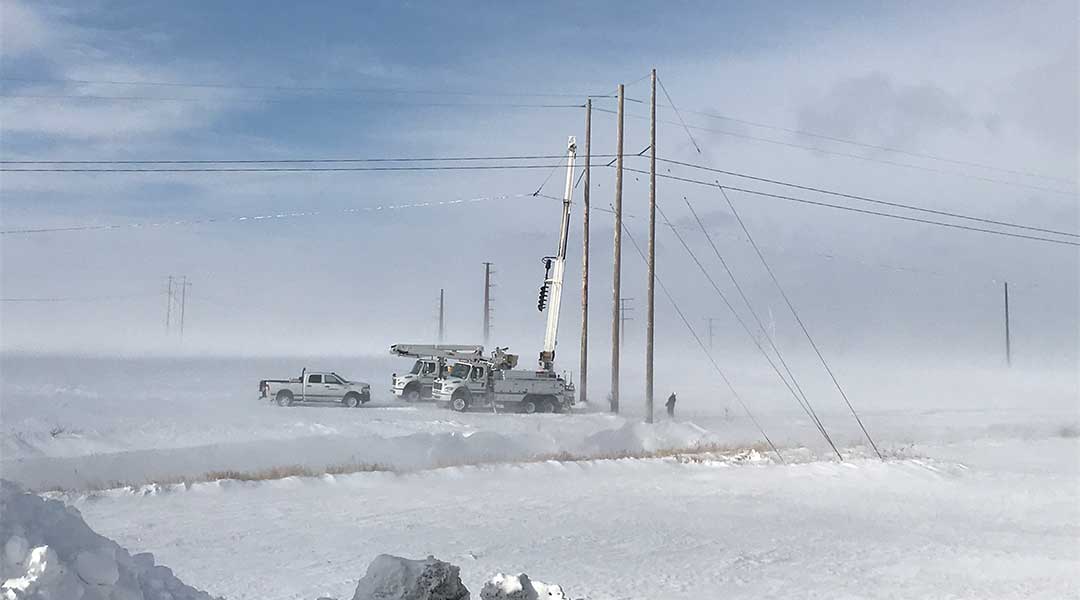 MidAmerican Employees fixing a substation lines in the middle of a snow storm