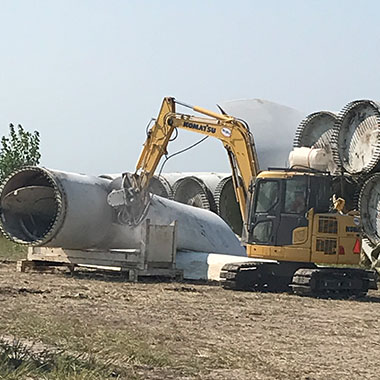 MidAmerican employee cutting a wind turbine blade and Recycled