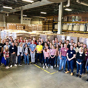 Interns group picture in a warehouse