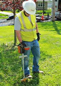 MidAmerican employee checking the gas pipeline in a residential area