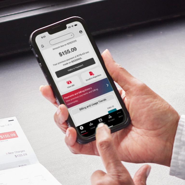 closeup of a hand holding a smartphone displaying MidAmerican Energy's outage map