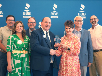 MidAmerican Energy leaders accepting the Better Business Bureau's Torch Award in 2025
