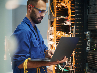 A technician working in a data center