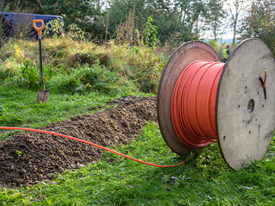 A long roll of fiber optic cable to be buried underground