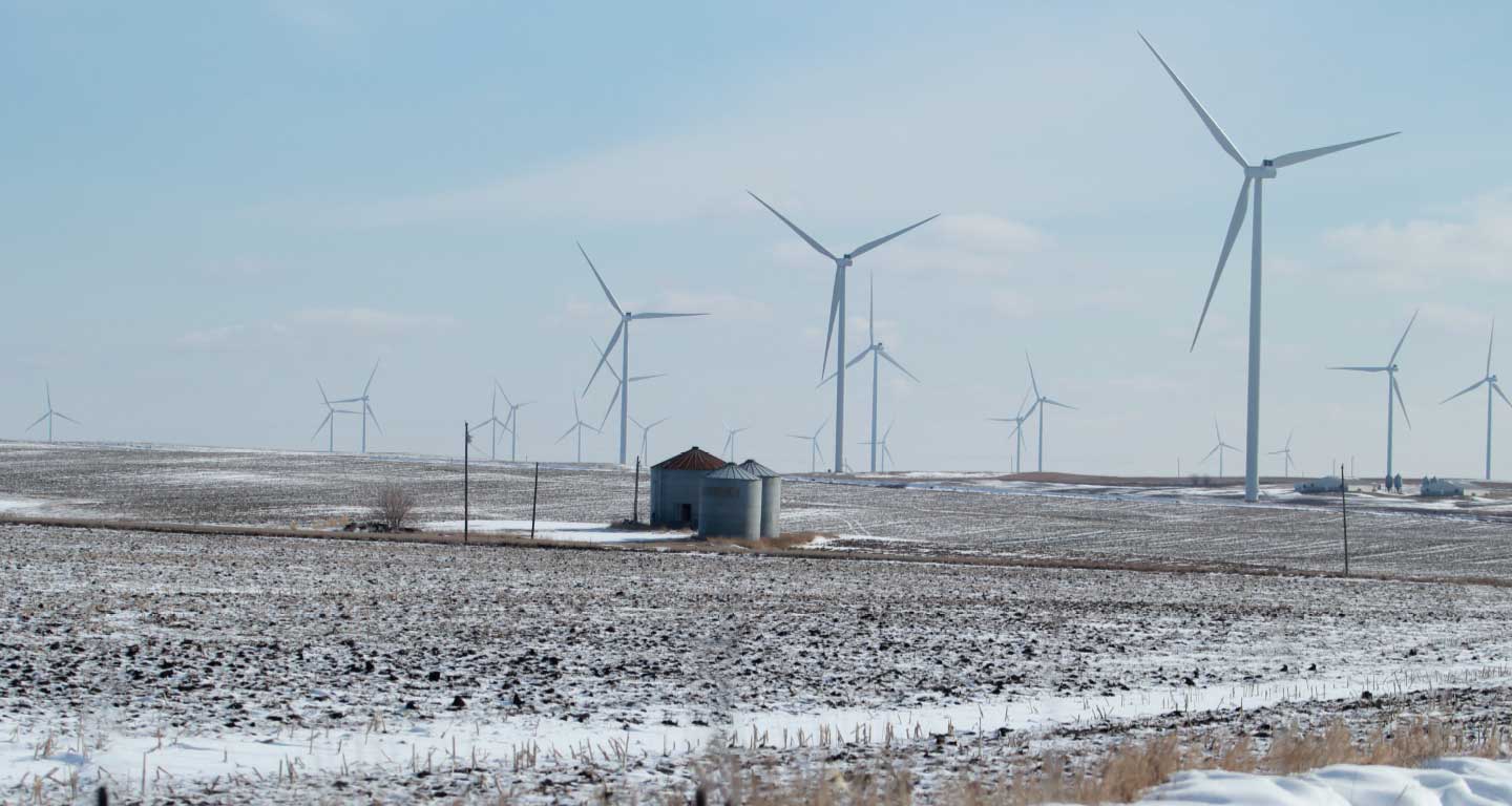 Snowy weather, multiple turbines, small grain bin