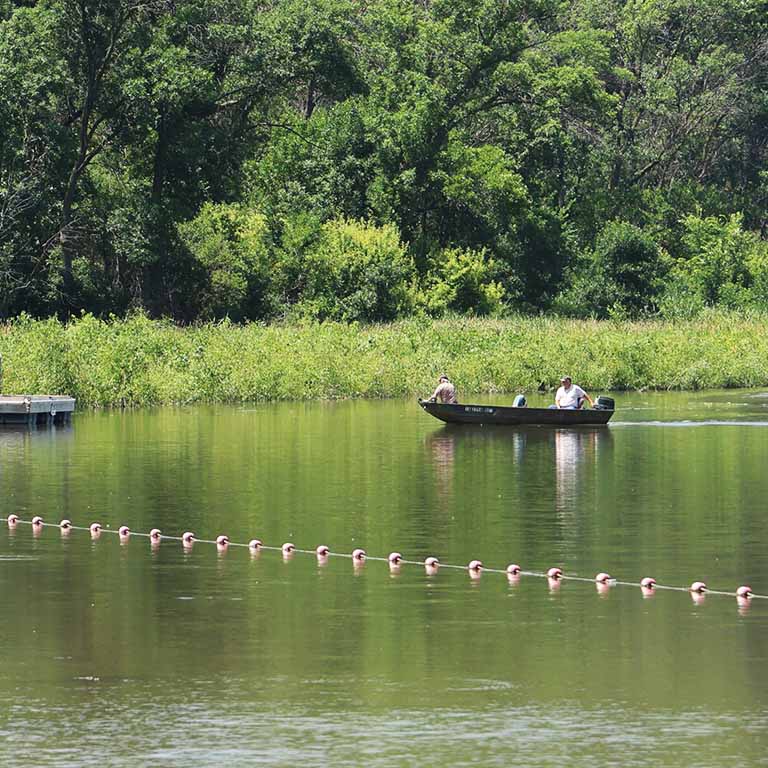 Boaters enjoying Brown's Lake, which was recently restored with help from MidAmerican Energy
