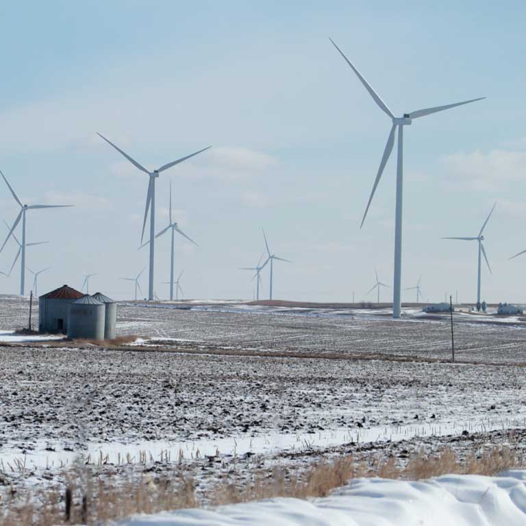 Snowy weather, multiple turbines, small grain bin