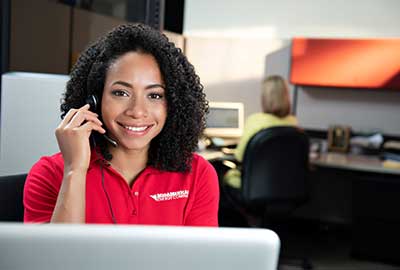 MidAmerican employee Customer Service Representative talking on the phone