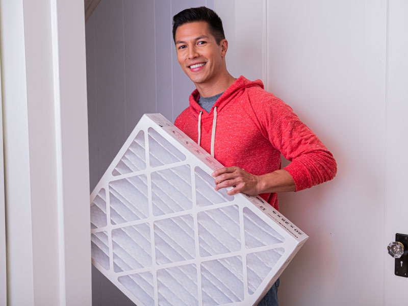 man holding furnace filter