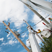 MidAmerican employee working on a utility pole