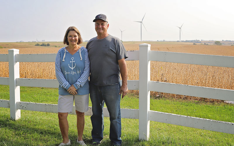 Photo of Dave and Tracee Van Arkel in front of one of their crop fields